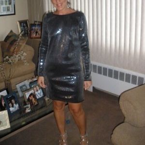 Black cocktail dress covered in clear sequins